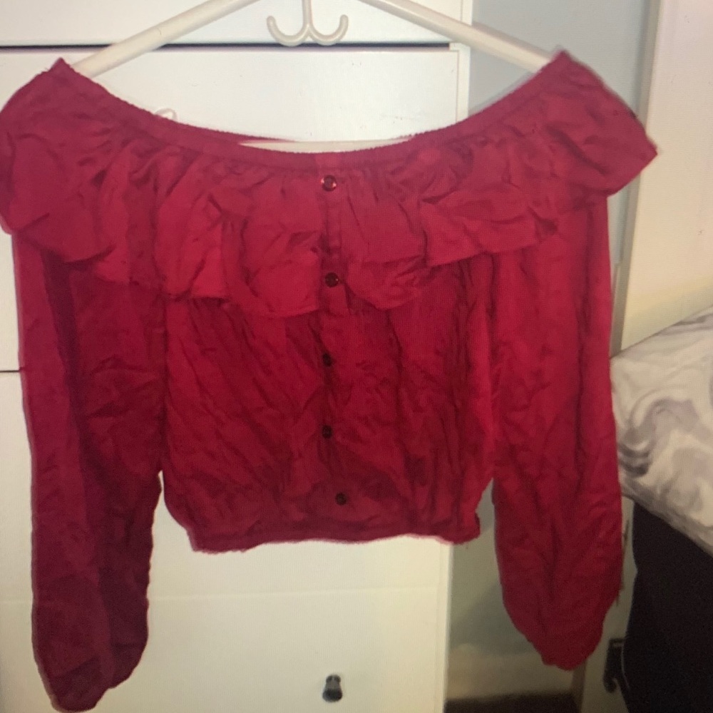 Large red off the shoulder long sleeve top.